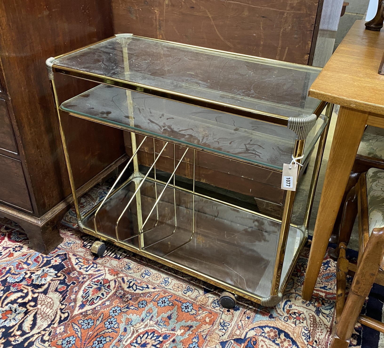 A mid century Italian brass and glass music / drinks trolley, width 80cm, depth 40cm, height 69cm